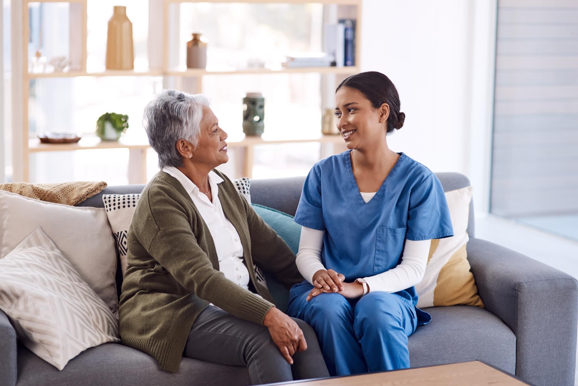 A carer assists with everyday hygiene at the bedside